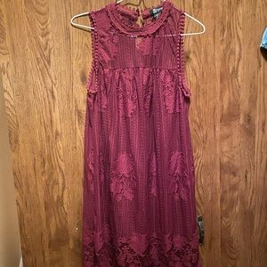 Wore it once size medium. Maroon color lace